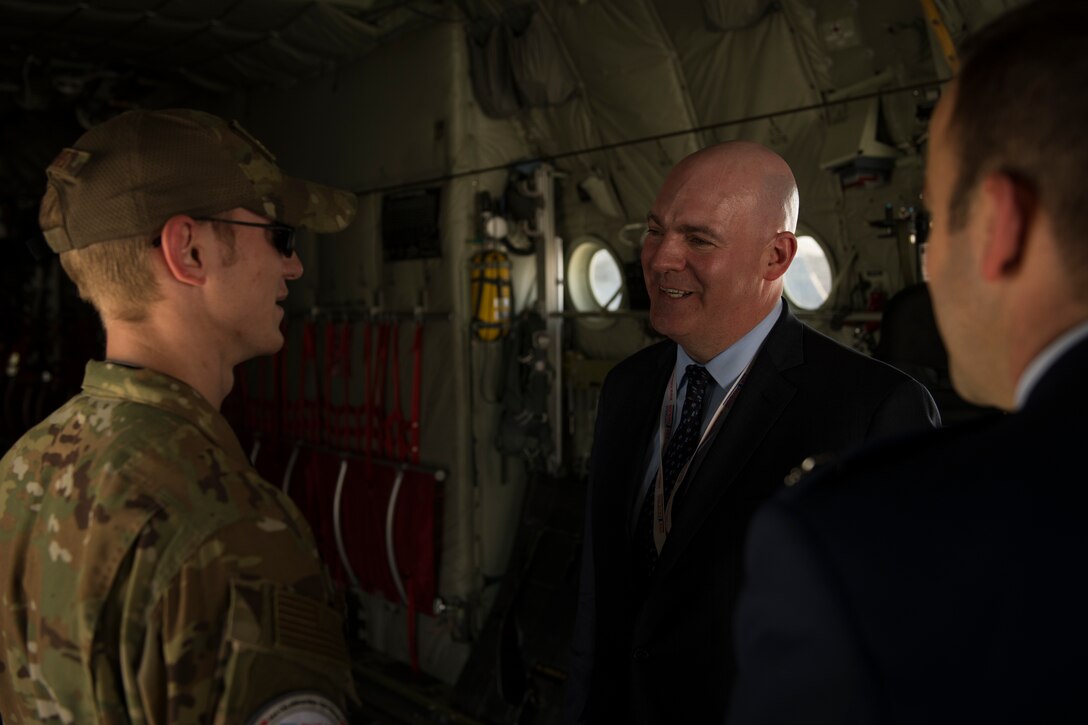 R. Clarke Cooper, right, Assistant Secretary of State for Political-Military Affairs, converses with U.S. Air Force Senior Airman Nolan Brandt, a loadmaster with the 774th Expeditionary Airlift Squadron, inside a C-130J Super Hercules at the Dubai Airshow, United Arab Emirates, Nov. 17, 2019.