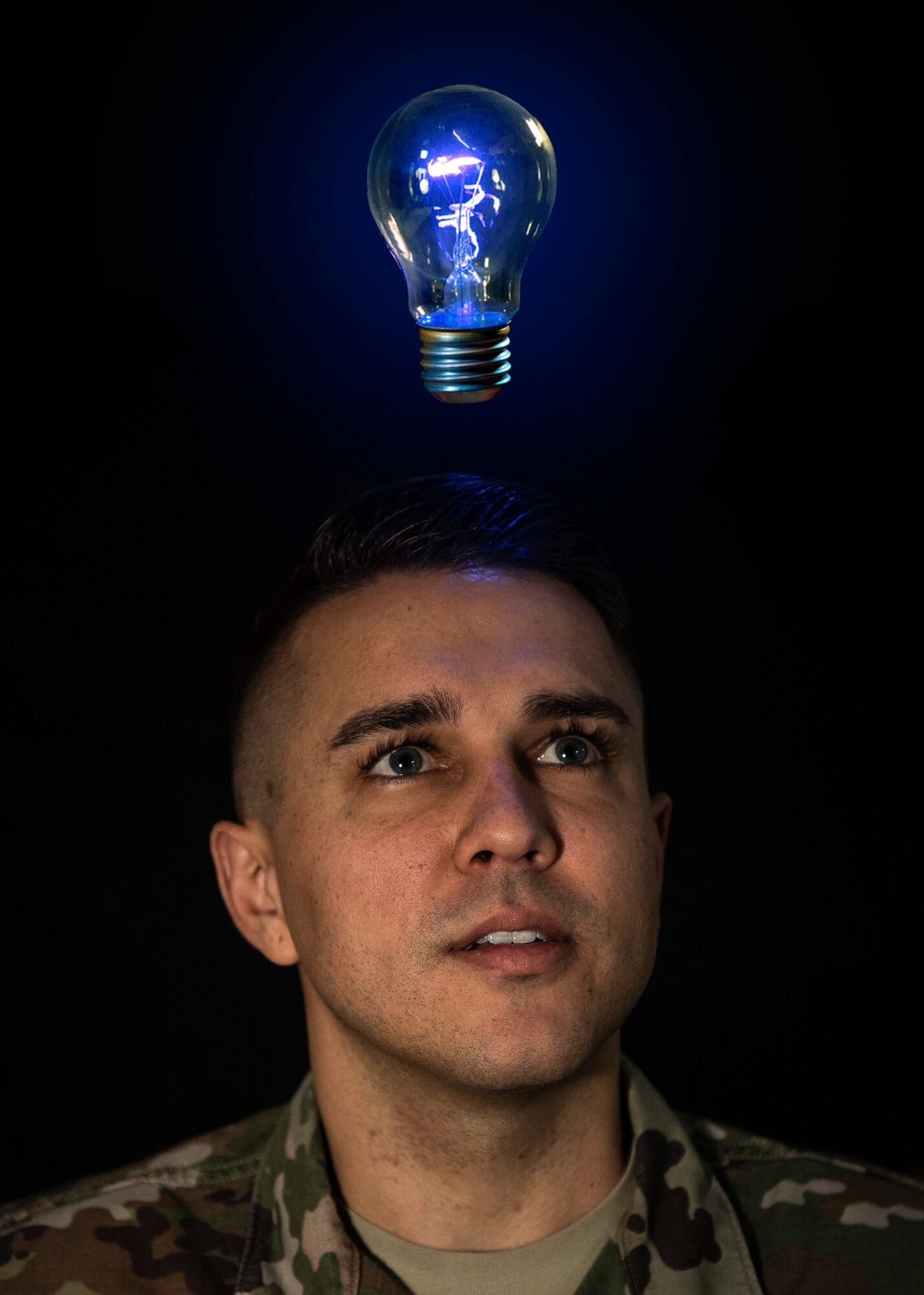 U.S. Air Force Staff Sgt. Preston Cherry, 52nd Fighter Wing Public Affairs photojournalist, poses for a photo illustration at Spangdahlem Air Base, Germany, Nov. 22, 2019. Airmen who have innovative ideas of how to better their workplace can contact the 52nd Innovation and Transformation Office. The ITO team teaches Airmen about continual process improvement, which can improve productivity and morale. (U.S. Air Force photo illustration by Airman 1st Class Valerie Seelye)