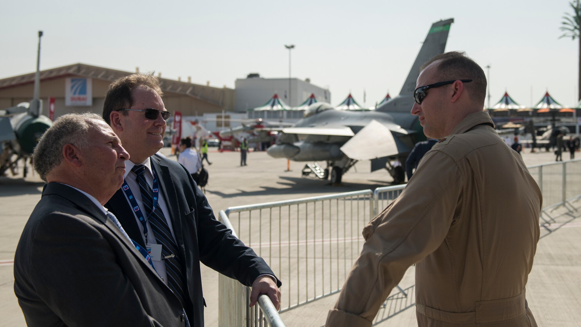 U.S. Navy Lt. Cmdr. Mike Ptacek, a naval flight officer with the "Bluetails" of Carrier Airborne Early Warning Squadron (VAW) 121, converses with spectators at Dubai Airshow, United Arab Emirates, Nov. 18, 2019.
