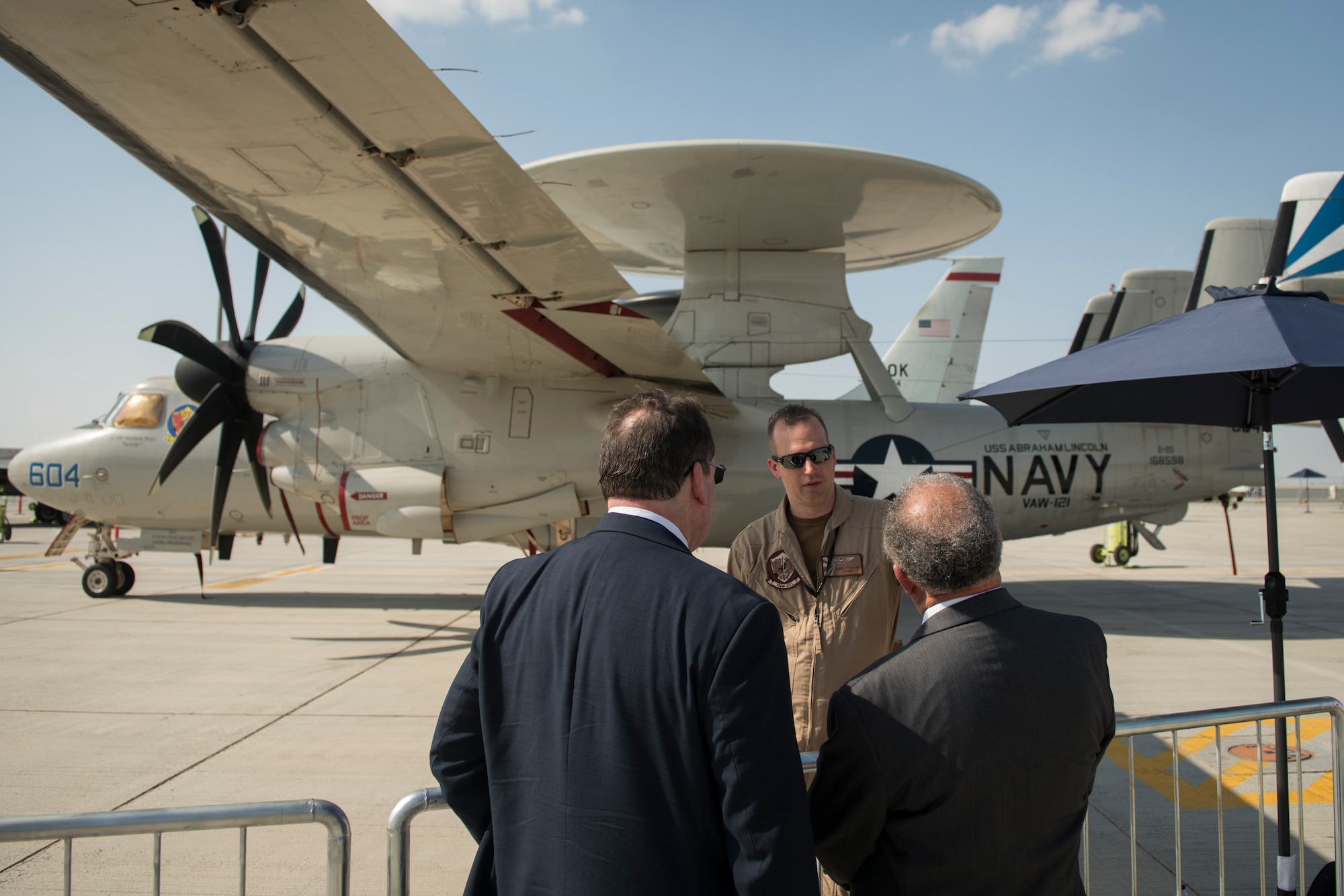 U.S. Navy Lt. Cmdr. Mike Ptacek, a naval flight officer with the "Bluetails" of Carrier Airborne Early Warning Squadron (VAW) 121, converses with spectators at Dubai Airshow, United Arab Emirates, Nov. 18, 2019.