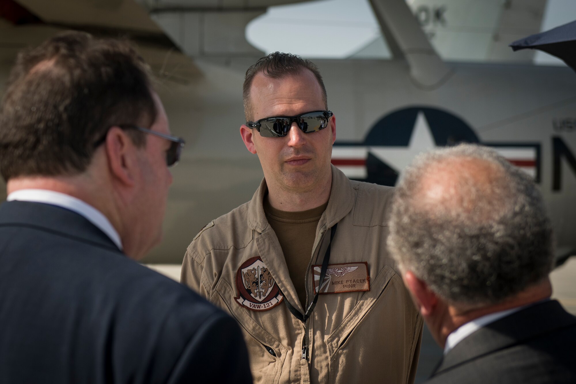 U.S. Navy Lt. Cmdr. Mike Ptacek, a naval flight officer with the "Bluetails" of Carrier Airborne Early Warning Squadron (VAW) 121, converses with spectators at Dubai Airshow, United Arab Emirates, Nov. 18, 2019.