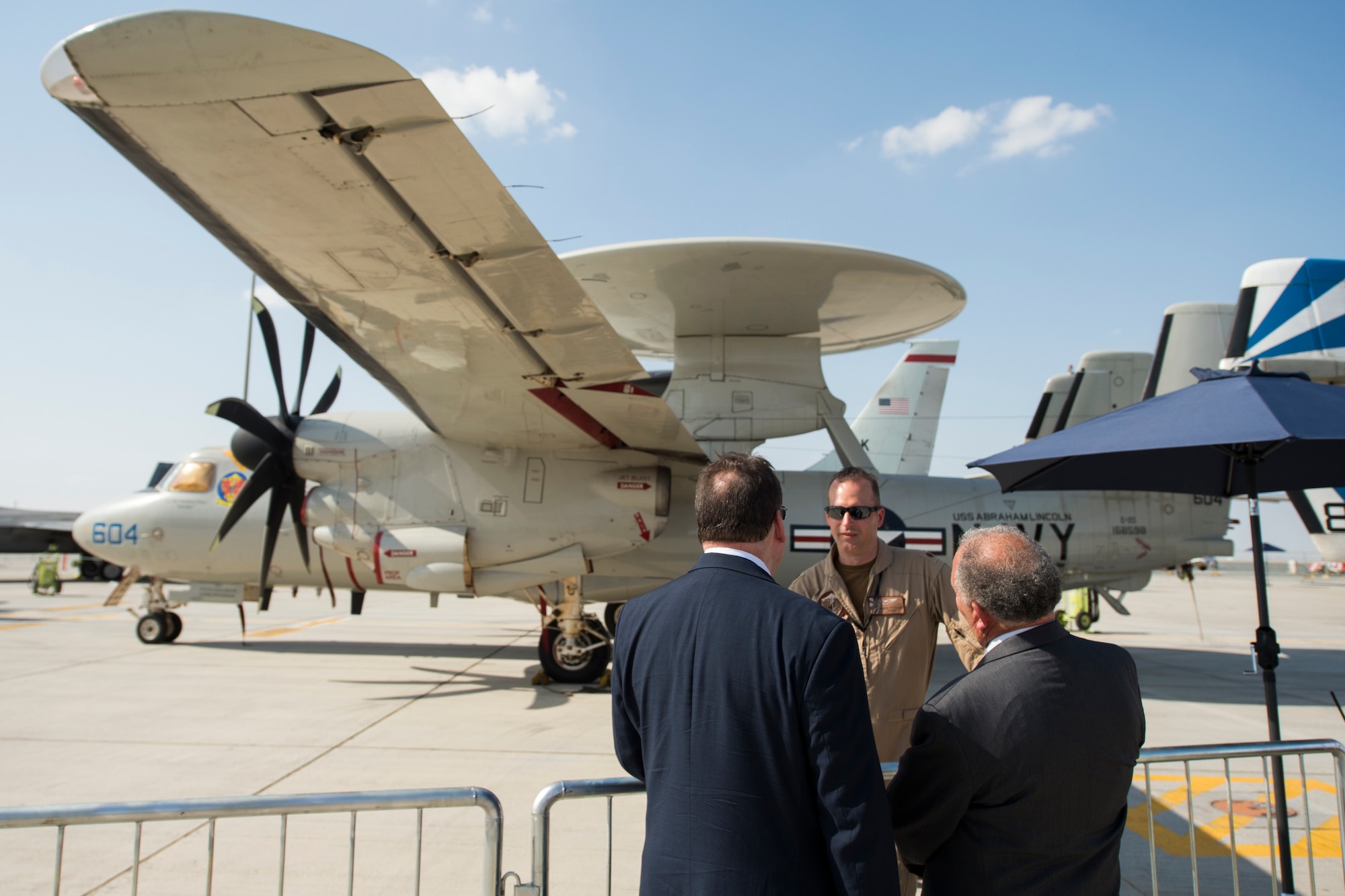 U.S. Navy Lt. Cmdr. Mike Ptacek, a naval flight officer with the "Bluetails" of Carrier Airborne Early Warning Squadron (VAW) 121, converses with spectators at Dubai Airshow, United Arab Emirates, Nov. 18, 2019.