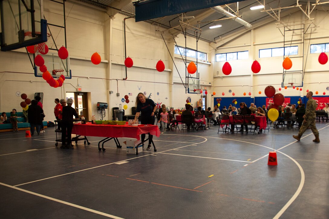 A photo of families gathered together for a Thanksgiving meal.