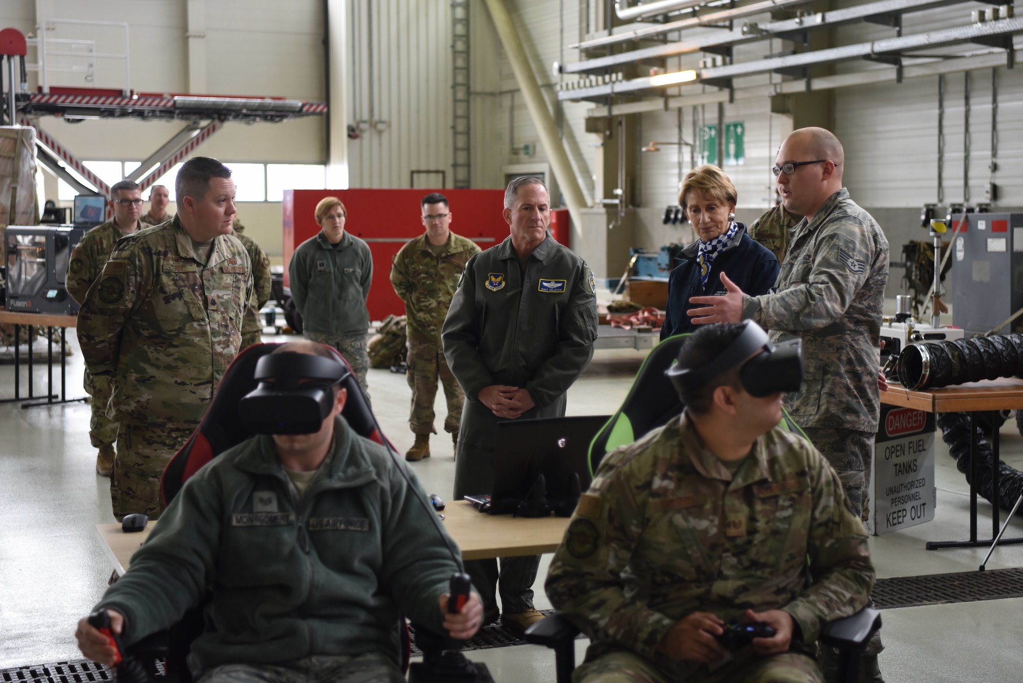 Members of 721st Maintenance Squadron discuss new training tactics with Air Force Chief of Staff Gen. David L. Goldfein and Secretary of the Air Force Barbara Barrett during a tour on Ramstein Air Base, Germany, Nov. 22, 2019.