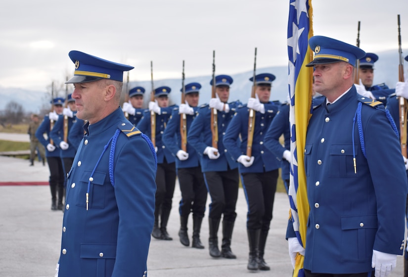 Dressed in blue uniforms, members of the Bosnia-Herzegovina military stand in formation.