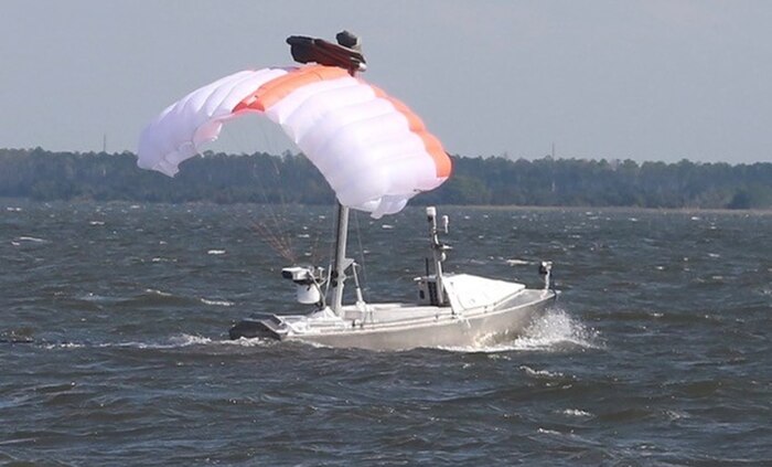 The Towed Airborne Lift of Naval Systems (TALONS) is a parafoil-based system shown kiting from the Greenough Advanced Rescue Craft. TALONS relays data between the MCM USV and the LCS via the government-developed multi-vehicle communication relays system.