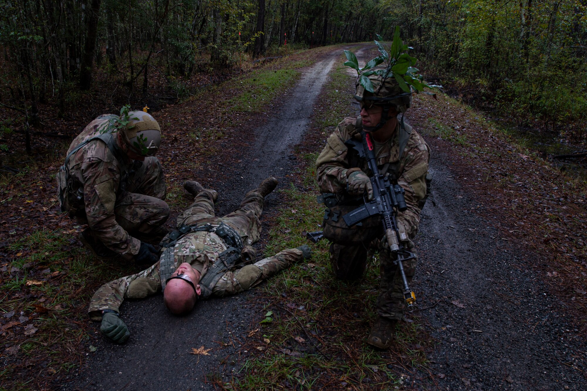 A photo of students of the Air Force Ranger Assessment Course performing a simulated casualty search