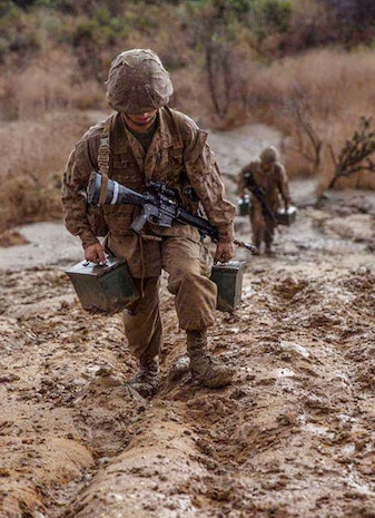 A recruit with Hotel Company, 2nd Recruit Training Battalion, carries an ammunition can up a hill during a crucible event at Marine Corps Base Camp Pendleton, California, Nov. 20, 2019.