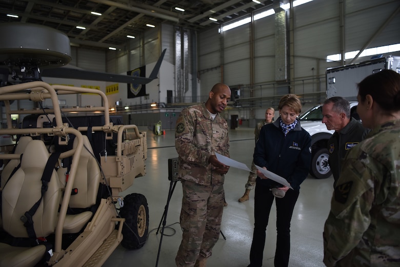 U.S. Air Force Staff Sgt. Sean Scott, 435th Air Ground Operations Wing, radar air and weather systems NCO, explains the equipment and procedures of the deployable air traffic control and landing systems to Air Force Chief of Staff Gen. David L. Goldfein and Secretary of the Air Force Barbara Barrett during briefing on Ramstein Air Base, Germany, Nov. 22. 2019.