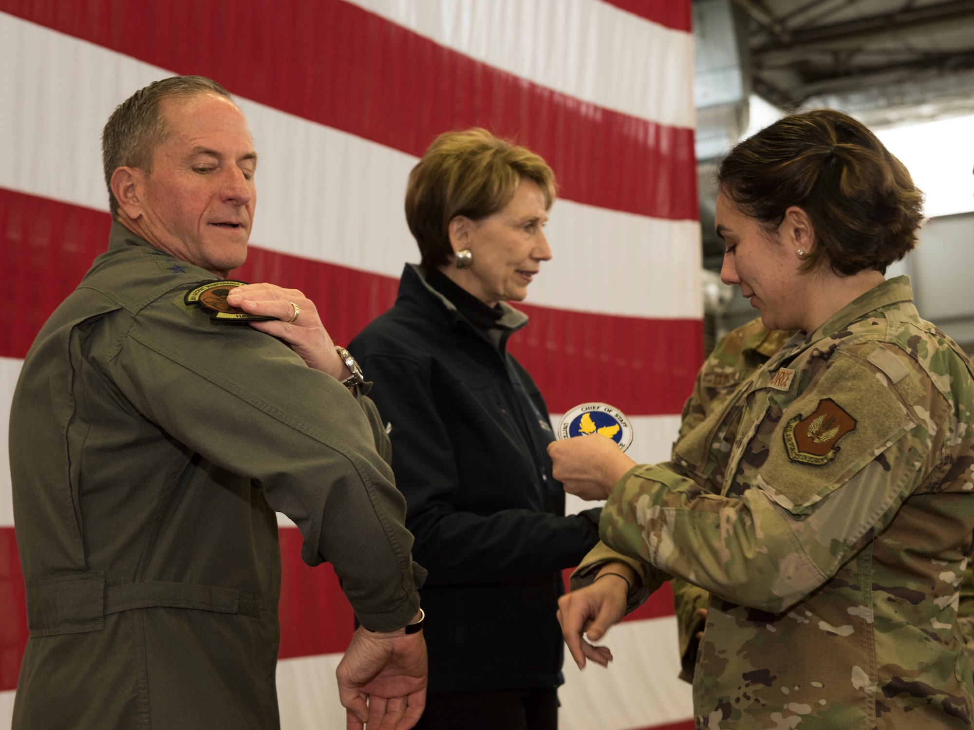 Air Force Chief of Staff Gen. David L. Goldfein trades squadron patches with an Airman after a town hall on Ramstein Air Base, Germany, Nov. 22, 2019.