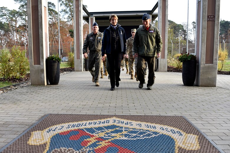 Secretary of the Air Force Barbara M. Barrett (center), U.S Air Force Chief of Staff Gen. David L. Goldfein, and Col. Cary Culbertson, 603rd Air Operations Center commander, walk towards the AOC during a base visit at Ramstein Air Base, Germany, Nov. 22, 2019.