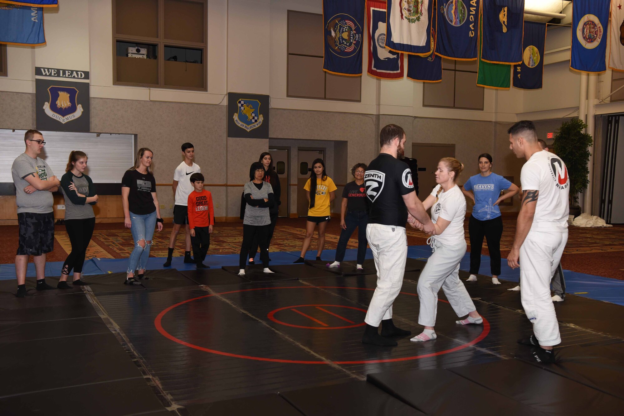 Airmen and families from Team McConnell attend a self-defense class Nov. 23, 2019, at McConnell Air Force Base, Kan. The class provided attendees with safety strategies, physical techniques to successfully escape an attack and psychological awareness. (U.S. Air Force photo by Airman 1st Class Alexi Bosarge)