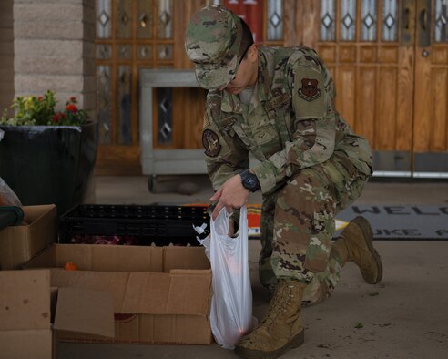 Airman 1st Class Isaac Leguizamo, 61st Aircraft Maintenance Unit avionics technician, volunteers at the annual Turkeys for Troops food drive Nov. 21, 2019, at Luke Air Force Base, Ariz.