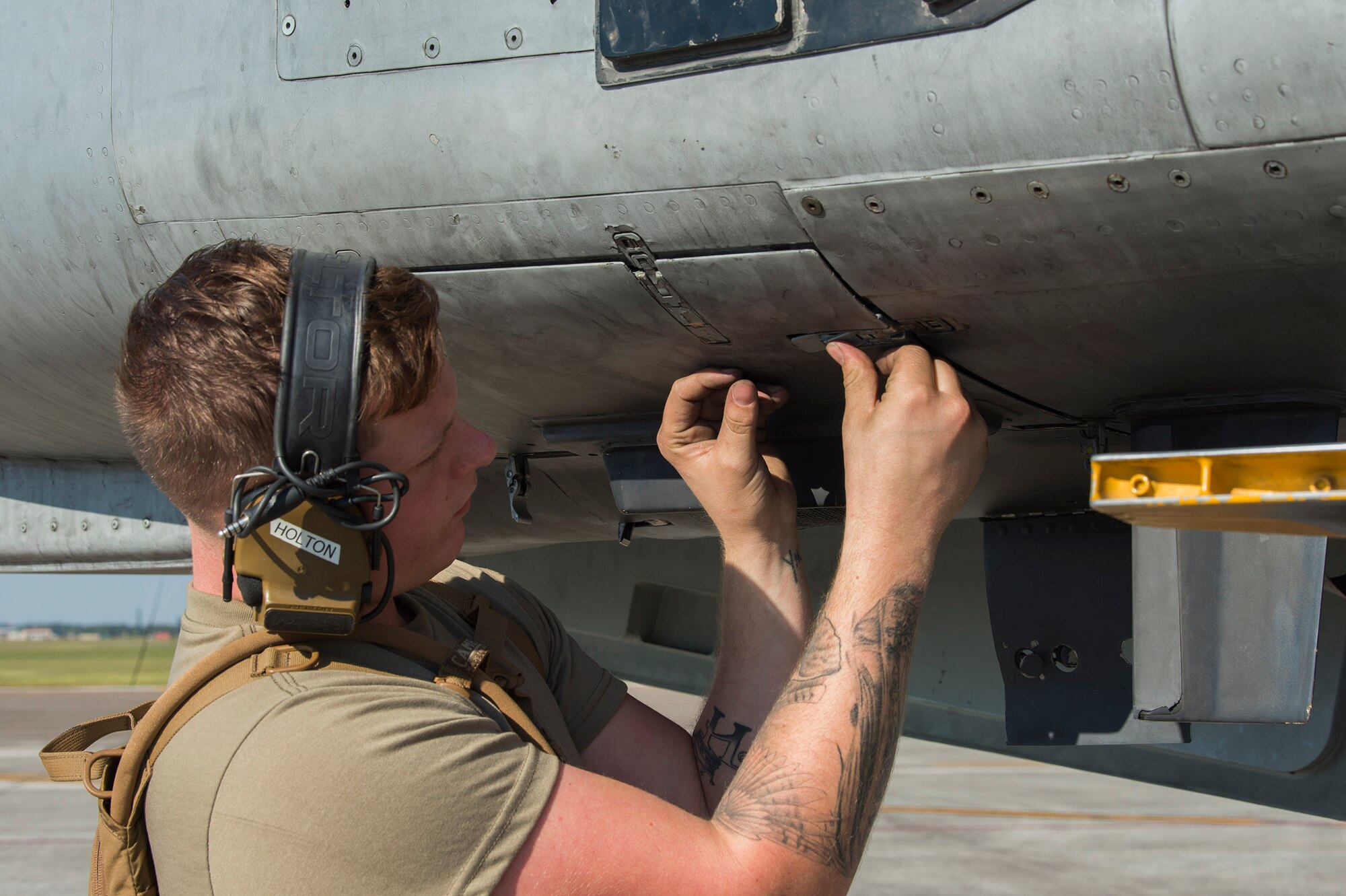 U.S. Air Force Senior Airman Dylan Holton, a weapons load crewmember assigned to the 23rd Aircraft Maintenance Squadron, Moody Air Force Base, Ga., closes a panel on an A-10 Thunderbolt II assigned to the 74th Fighter Squadron, Moody AFB, during Exercise Mobil Tiger Nov. 19, 2019 on MacDill Air Force Base, Fla.