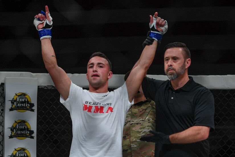 Joshua Lilley, Cage Fury Fighting Championship fighter, celebrates his second career win during the CFFC 80 at Joint Base Langley-Eustis, Virginia, Nov. 22, 2019.