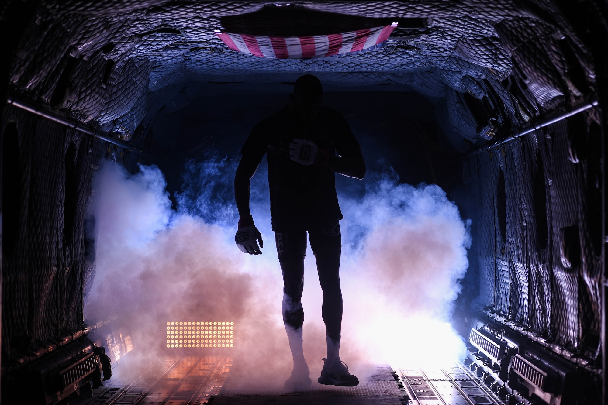 Tyus Thomas, Cage Fury Fighting Championship fighter, walks out of the back of CH-47 Chinook helicopter before a fight during CFFC 80 at Joint Base Langley-Eustis, Virginia, Nov. 22, 2019.