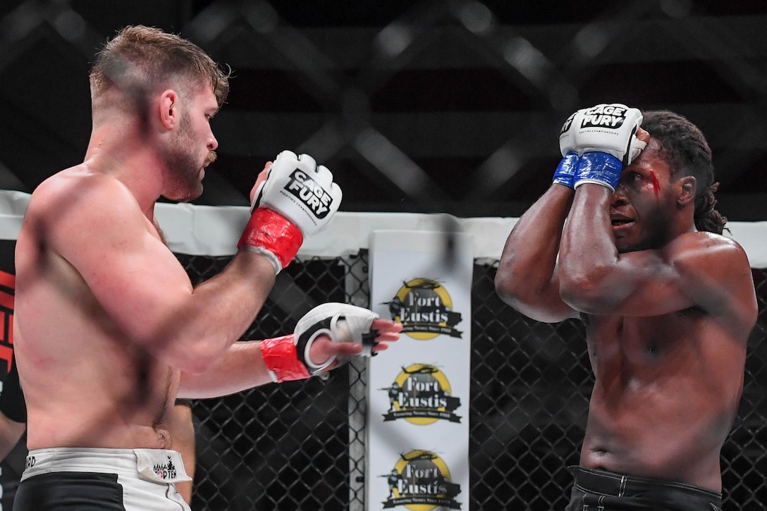 Christian Leonard and D’Juan Owens, Cage Fury Fighting Championship fighters, fight during CFFC 80 at Joint Base Langley-Eustis, Virginia, Nov. 22, 2019.
