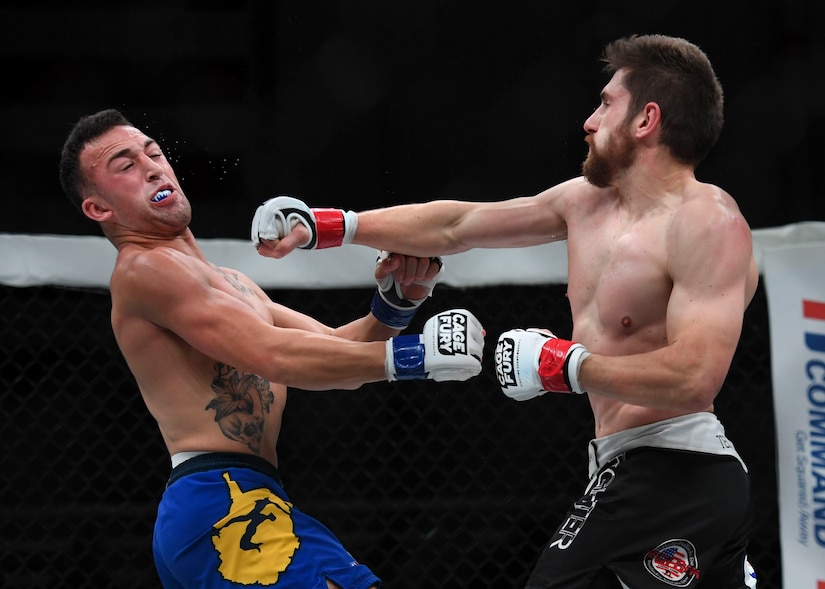 Nelson Tuckwiller punches Joshua Lilley during the Cage Fury Fighting Champion 80 “Fight for Troops” event at Joint Base Langley-Eustis, Virginia, Nov. 22, 2019.