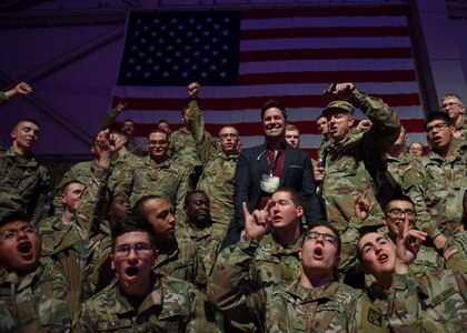 Robert Haydak, Cage Fury Fighting Championship president, poses with U.S. Army Soldiers during the CFFC 80 “Fight for Troops” event at Joint Base Langley-Eustis, Virginia, Nov. 22, 2019.