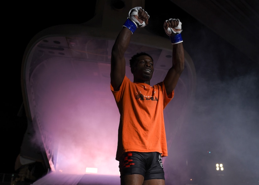 Will Spann III, Cage Fury Fighting Champion fighter, walks toward the ring during the CFFC 80 “Fight for Troops” event at Joint Base Langley-Eustis, Virginia, Nov. 22, 2019.