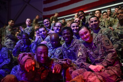 U.S. Army advanced individual training Soldiers pose for a photos during the Cage Fury Fighting Champion 80 “Fight for Troops” event at Joint Base Langley-Eustis, Virginia, Nov. 22, 2019.