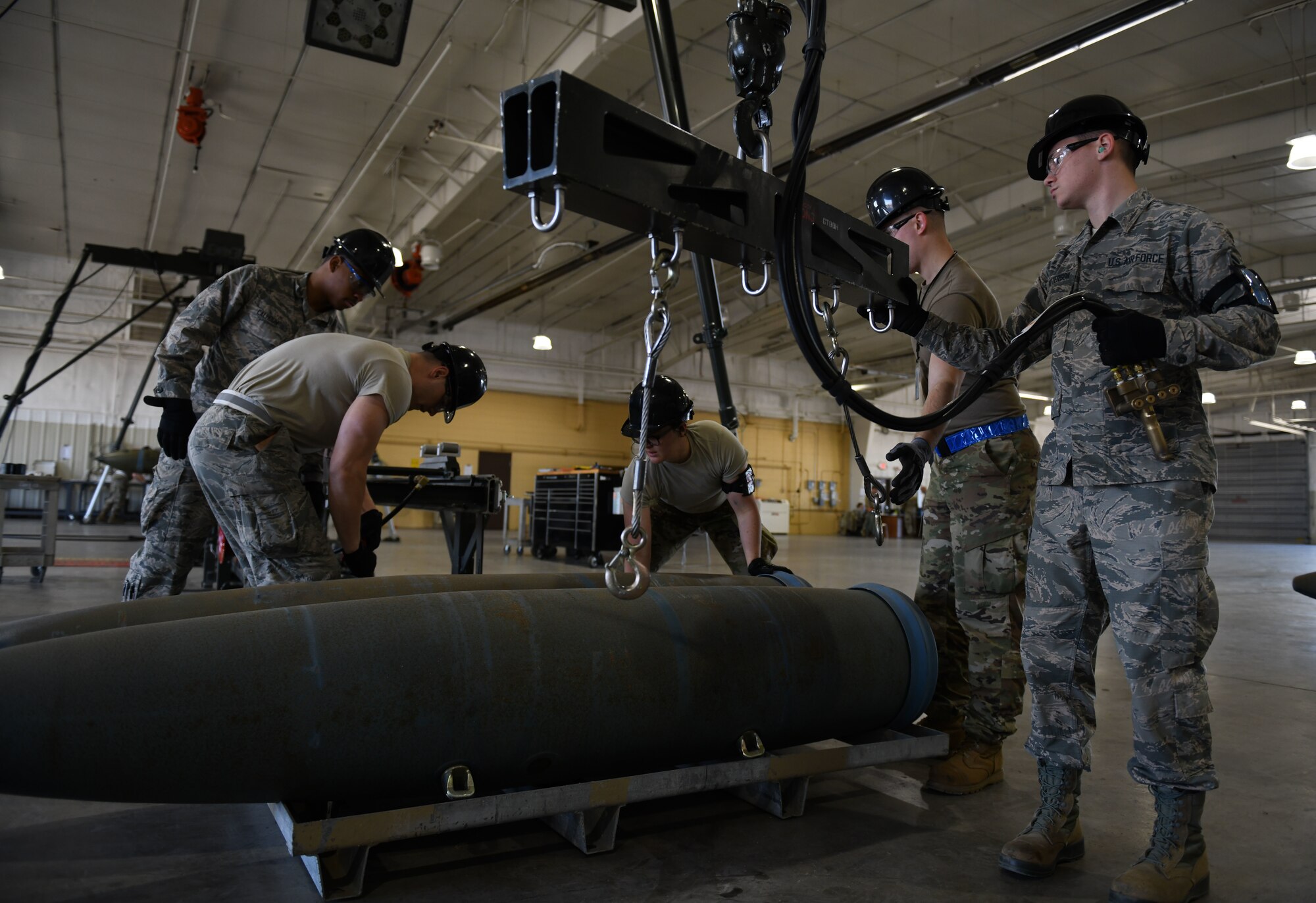 Airmen assigned to the 28th Munitions Squadron build weapons at Ellsworth Air Force Base, S.D., Oct. 21, 2019. The 28th MUNS recently garnered the 2019 Global Strike Challenge best conventional munitions maintenance team award. (U.S. Air Force photo by Airman 1st Class Christina Bennett)