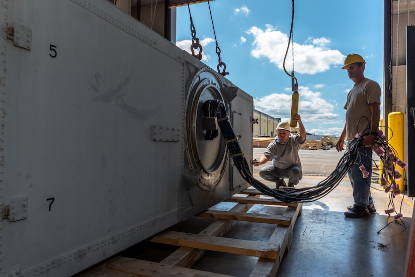 Photo of Technicians disassembling the first U.S. Navy RIM-7 Sea Sparrow at Tobyhanna Army Depot.