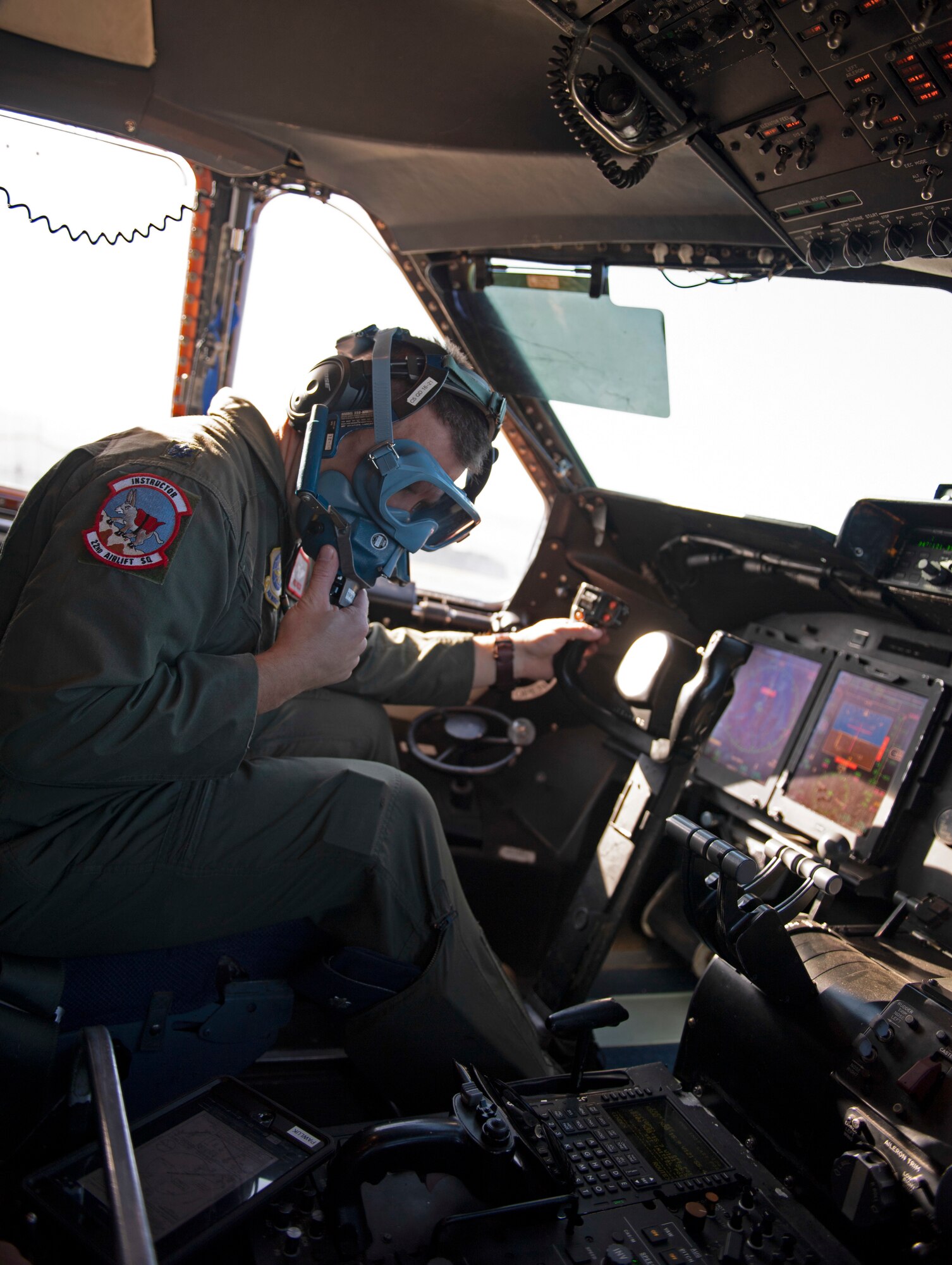 Photos of the 22nd Airlift Squadron preparing for flight.