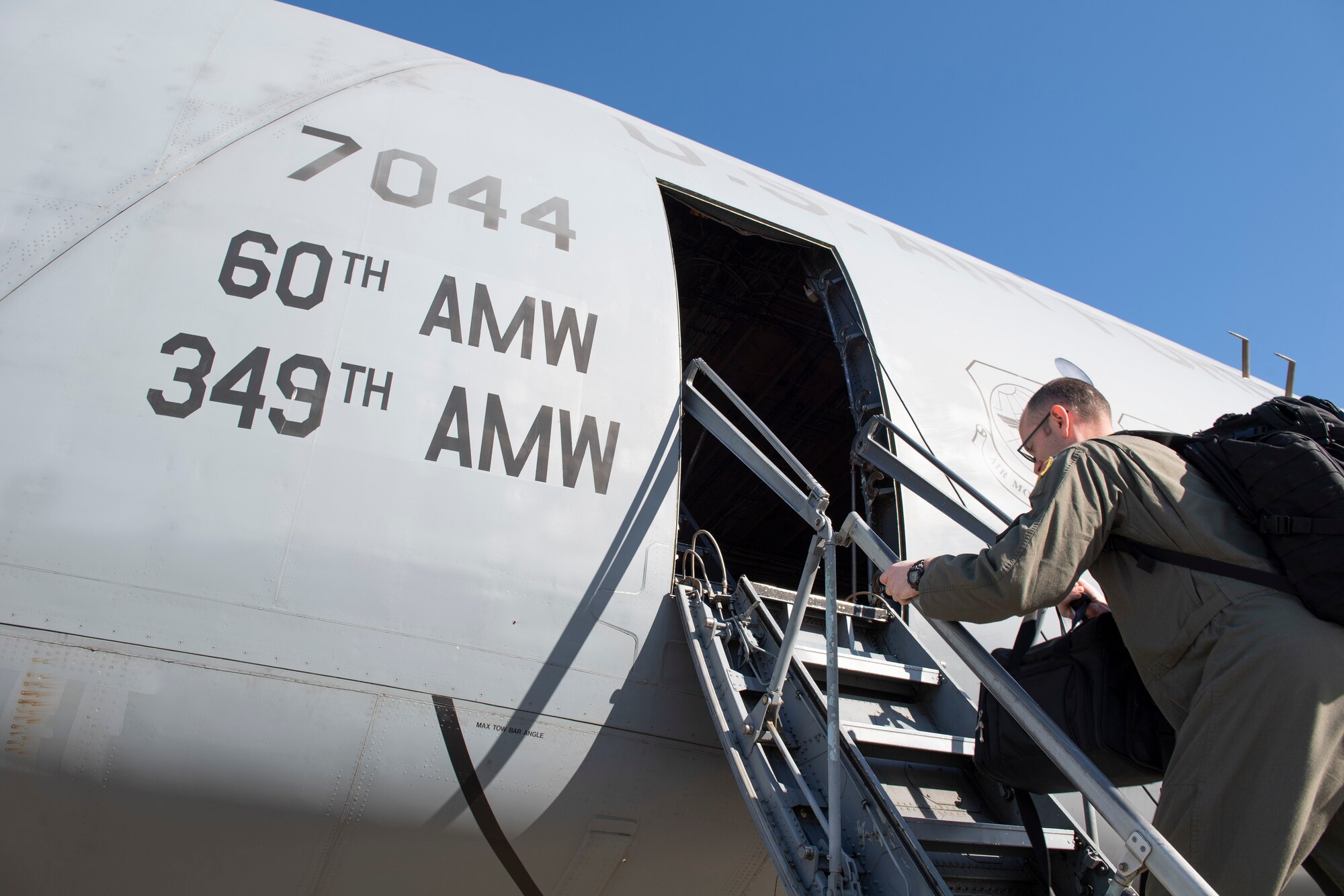 Photos of the 22nd Airlift Squadron preparing for flight.