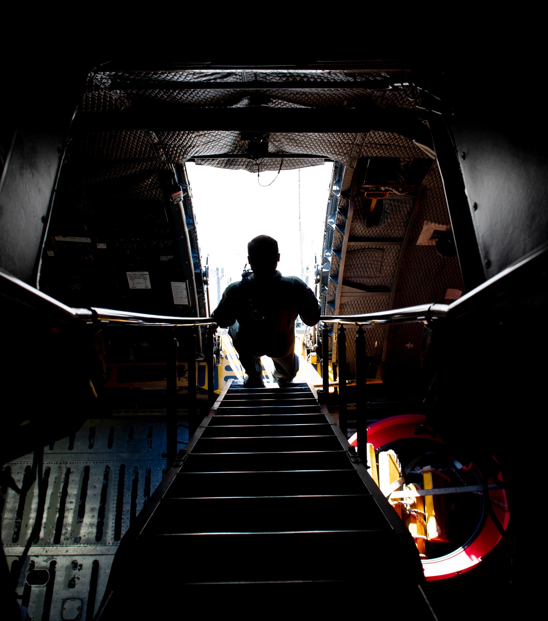 Photos of the 22nd Airlift Squadron preparing for flight.