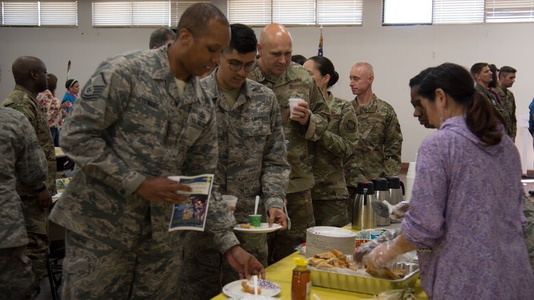 U.S. Air Force Airmen with Team MacDill stand in line to sample traditional Native American foods during a Native American Heritage Month Celebration, Nov. 21, 2019, at MacDill Air Force Base, Fla.  National Native American Heritage Month is held every November to recognize the contributions of American Indians to the development and growth of the U.S.