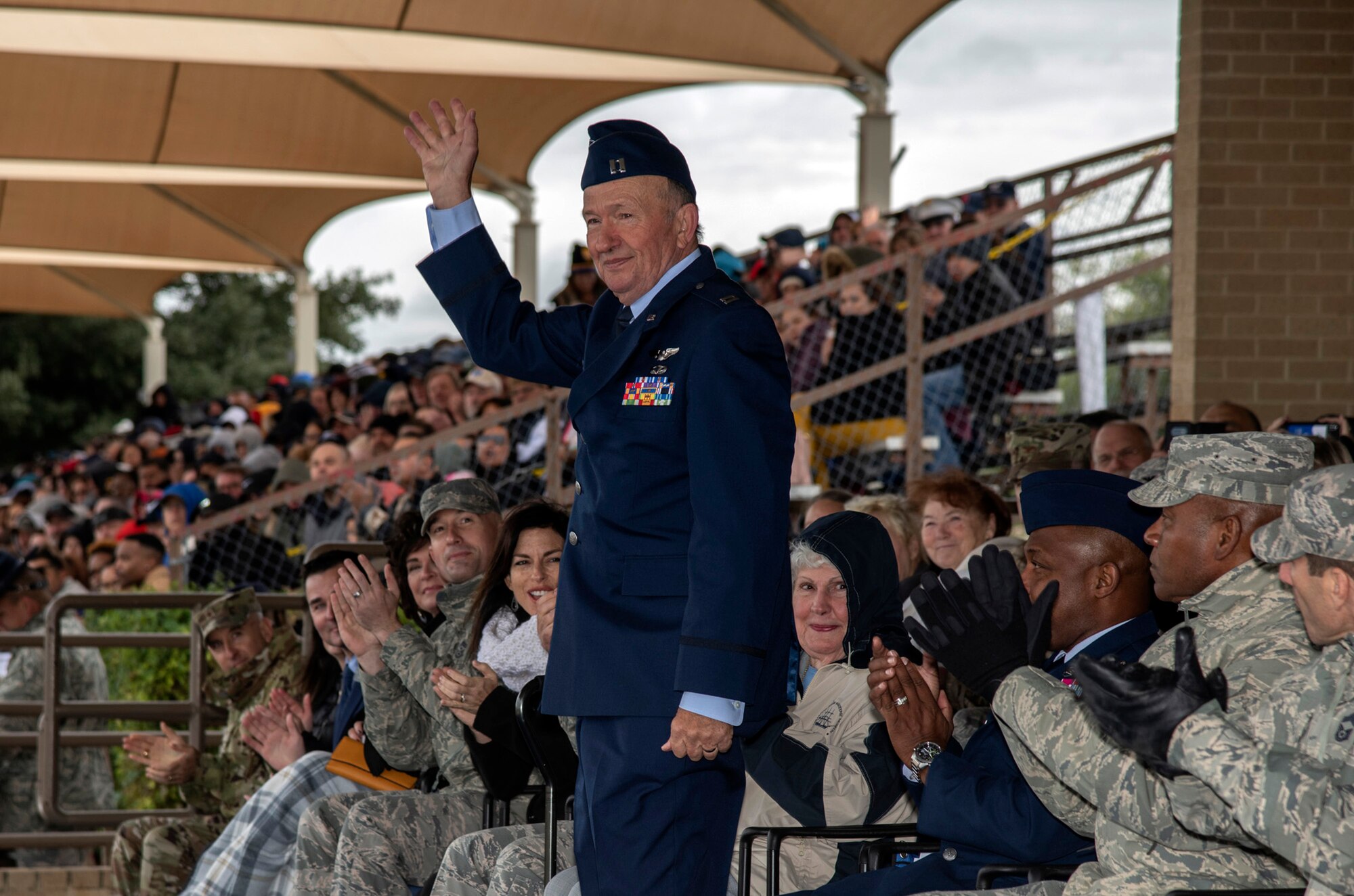 Retired Capt. Guy Gruters, a former F-100 Super Sabre pilot and prisoner of war, serves as the reviewing official during a U.S. Air Force basic military graduation Nov. 8, 2019, at Joint Base San Antonio-Lackland, Texas.  Gruters was an F-100 pilot for more than 20 years and spent more than five of those years as POW in a Vietnam internment camp. His decorations include more than thirty combat awards, including two Silver Stars, two Distinguished Flying Crosses, two Purple Hearts, a Bronze Star Medal for Valor, the POW Medal, a Presidential Unit Citation and 20 Air Medals.