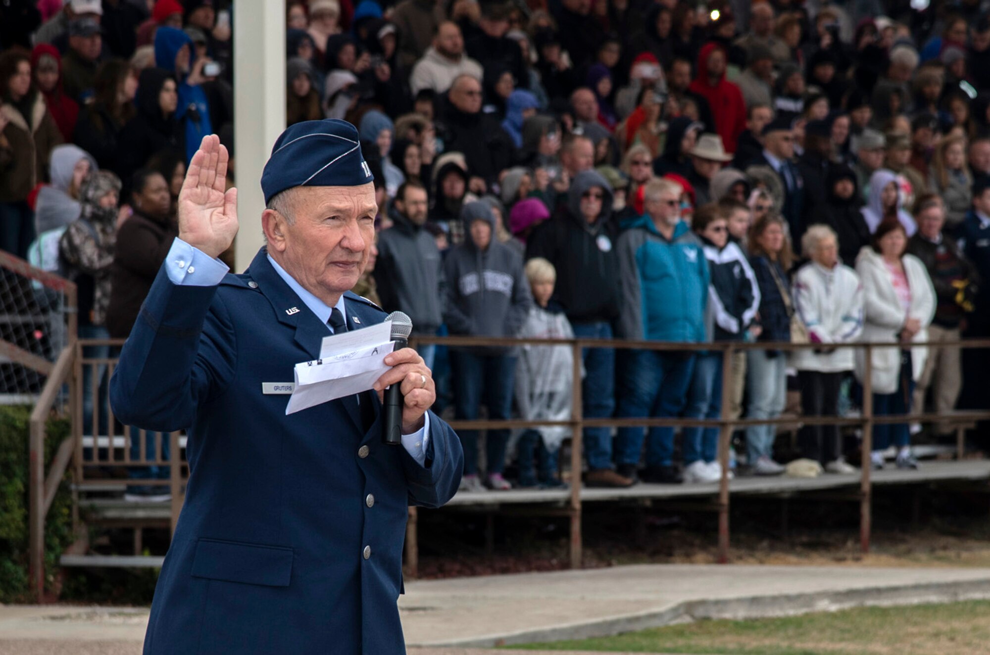 Retired Capt. Guy Gruters, a former F-100 Super Sabre pilot and prisoner of war, administers the Oath of Enlistment during a U.S. Air Force basic military graduation Nov. 8, 2019, at Joint Base San Antonio-Lackland, Texas.  Gruters was an F-100 pilot for more than 20 years and spent more than five of those years as POW in a Vietnam internment camp. His decorations include more than thirty combat awards, including two Silver Stars, two Distinguished Flying Crosses, two Purple Hearts, a Bronze Star Medal for Valor, the POW Medal, a Presidential Unit Citation and 20 Air Medals.