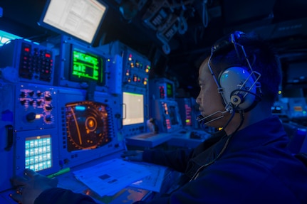 IMAGE: PHILIPPINE SEA -- Chief Warrant Officer Vergel Amado stands watch in the combat information center aboard the Arleigh Burke-class guided-missile destroyer USS Curtis Wilbur (DDG 54). More than 150 technical experts from Naval Surface Warfare Center (NSWC) Dahlgren Division, NSWC Philadelphia Division, and NSWC Indian Head Explosive Ordnance Disposal Technology Division attended a Nov. 8, 2019 event -- called Dahlgren Innovation Day -- for discussions and demonstrations about technologies that will impact the current and future fleet, including guided-missile destroyers. "We saw demonstrations that involved artificial intelligence, machine learning, sensors, quantum-based computing, cloud-native technologies, automation, blockchain, and other advanced capabilities that will have a dramatic impact on our development of innovative solutions for the fleet," said Laura Martin, program manager for the Information Technology Hyper Convergence - Hybrid Cloud Team at NSWC Dahlgren Division. (U.S. Navy photo by Mass Communication Specialist 3rd Class Ellen Hilkowski/Released)