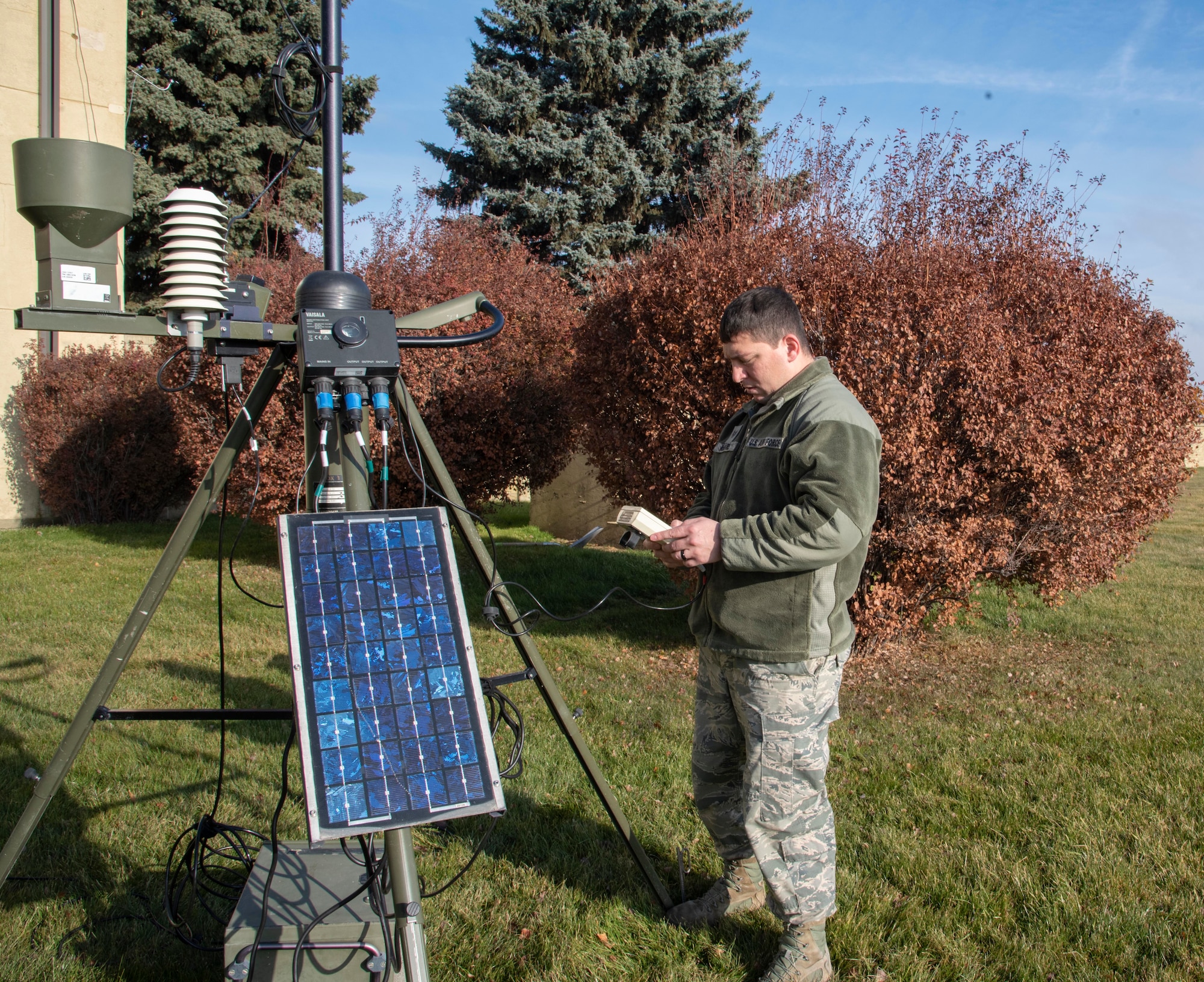 U.S. Air Force Tech Sgt. Johnny McGuire, 92nd Operational Support Squadron weather forecaster, looks at the main data display on the TMQ-53 weather sensor at Fairchild Air Force Base, Washington, Nov. 14, 2019.
