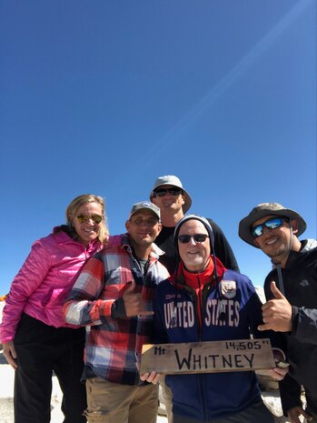 Naval Surface Warfare Center, Port Hueneme Division (NSWC PHD) Technical Director Paul Mann at the summit of California’s Mount Whitney, which, at nearly 14,500 feet, is the highest peak in the contiguous United States. Joining Mann were NSWC PHD’s In-Service Engineering Agent of the Future military lead Lt. Todd Coursey and Air Defense Engineer Douglas Trafican, among others. From left: Carmella Cuva; Coursey, Trafican in back, Mann and Seth Escobar at the Mt. Whitney summit.