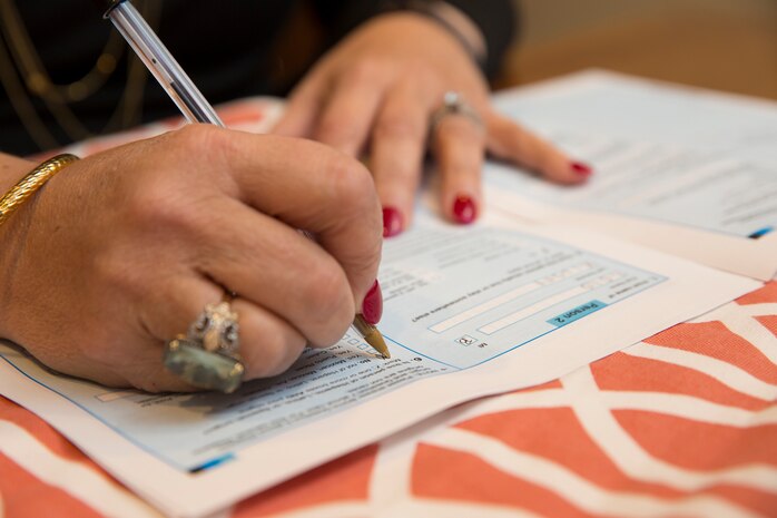 Woman fills out census form.