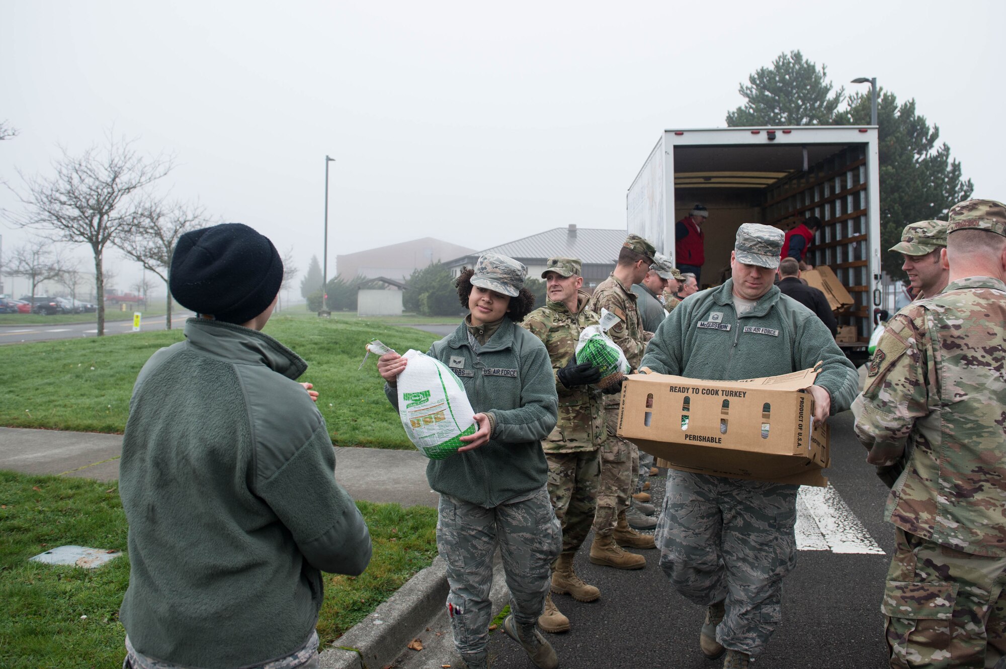 62nd Airlift Wing Airmen unload turkeys during Operation Turkey Drop, Nov. 21, 2019 at Joint Base Lewis-McChord, Wash. Local businesses donated over 250 turkeys to Team McChord Airmen this year.