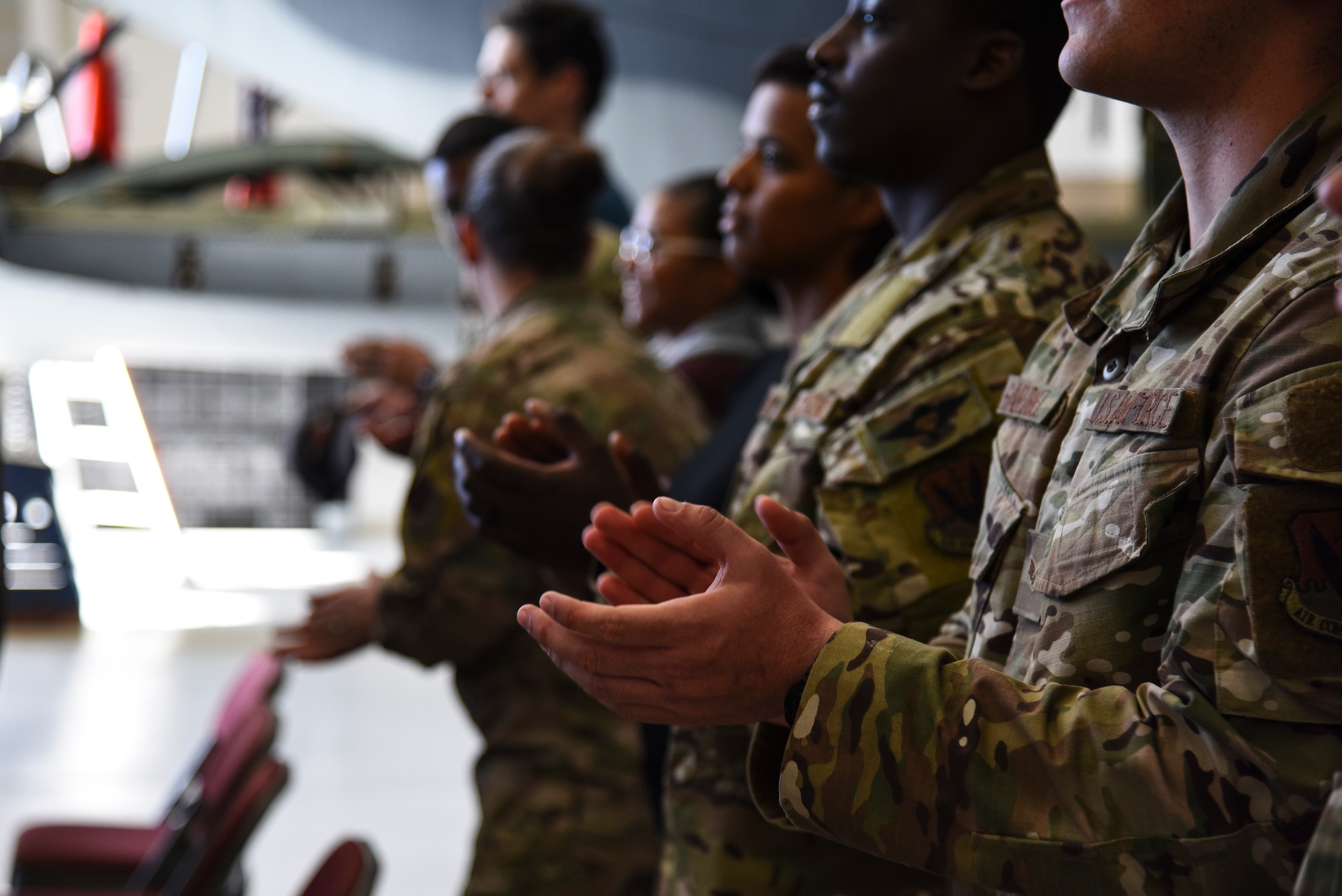 A photo of airmen applauding.