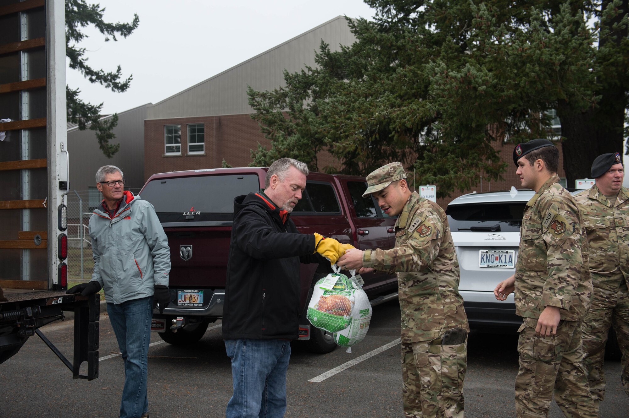 62nd Airlift Wing Airmen unload turkeys during Operation Turkey Drop, Nov. 21, 2019 at Joint Base Lewis-McChord, Wash. Local businesses donated over 250 turkeys to Team McChord Airmen this year.