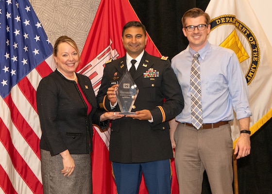 Jill E. Stiglich, U.S. Army Corps of Engineers directorate of Contracting, presents the “Best District/Center Award” to Lt. Col. Sonny B. Avichal, Nashville District commander, and Isaac Taylor, Branch Contracting chief, during the Society of American Military Engineers Federal Small Business Conference Excellence in Contracting Awards Program Nov. 21, 2019 in Dallas, Texas. (Photo by Angela Randall)