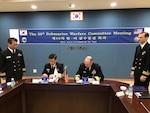 Rear Adm. Jimmy Pitts, Commander, Submarine Group 7, right, signs a memorandum with Rear Adm. Jung Il Shik, Commander, ROK Navy Submarine Force at the conclusion of the 50th semiannual Submarine Warfare Committee Meeting (SWCM) in Jeju, South Korea. Over the past 25 years, leaders of both the U.S. and ROK submarine forces have met consistently in recognition of the importance of combined submarine training and force integration. (U.S. Navy photo by LT Gregory Pavone)