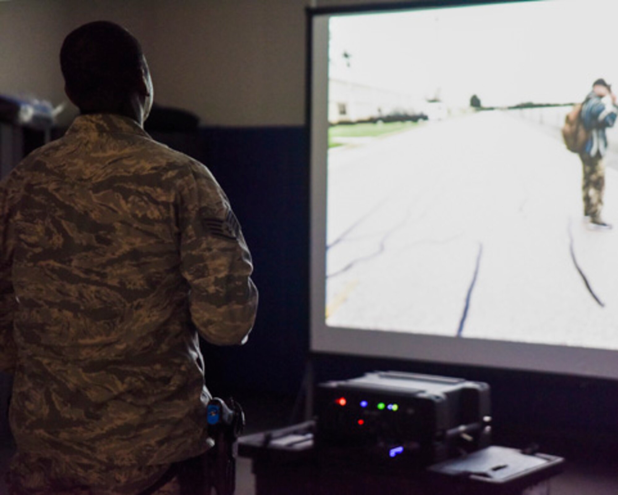 A Security Forces Airman, assigned to the 189th Airlift Wing, Arkansas Air National Guard, accomplishes use of force training on the simulator designed to supplement annual training in Little Rock, Ark., Nov. 3, 2019. The simulator offers 27 Guard-specific scenarios to ensure defenders’ currency. (U.S. Air National Guard photo by Master Sgt. Jessica Roles)