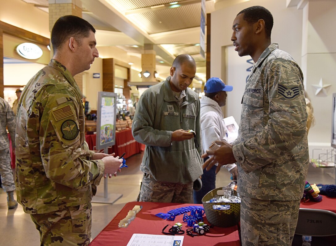 An image of two Airmen connecting through Tinker Hobby Hub, a new platform to link up Airmen through similar interests