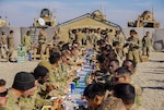 Soldiers assigned to 3rd Cavalry Regiment enjoy Thanksgiving dinner on Fire Base Saham, Iraq, Nov. 20, 2018. This year, Army Central Command plans to feed about 50,000 troops, government civilians, contractors and coalition partners across its area of operations. (Photo Credit: Capt. Jason Welch)