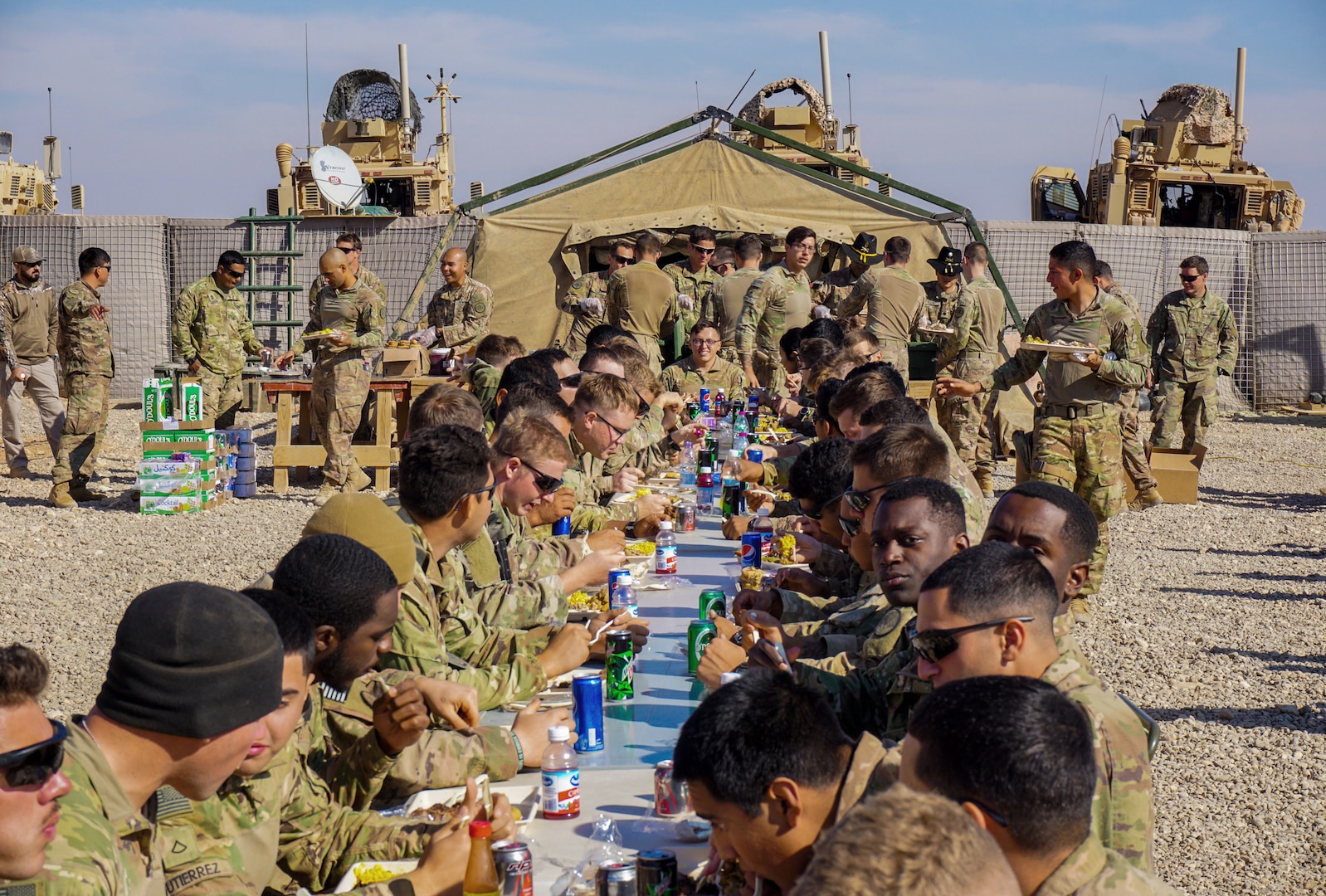 Soldiers assigned to 3rd Cavalry Regiment enjoy Thanksgiving dinner on Fire Base Saham, Iraq, Nov. 20, 2018. This year, Army Central Command plans to feed about 50,000 troops, government civilians, contractors and coalition partners across its area of operations. (Photo Credit: Capt. Jason Welch)
