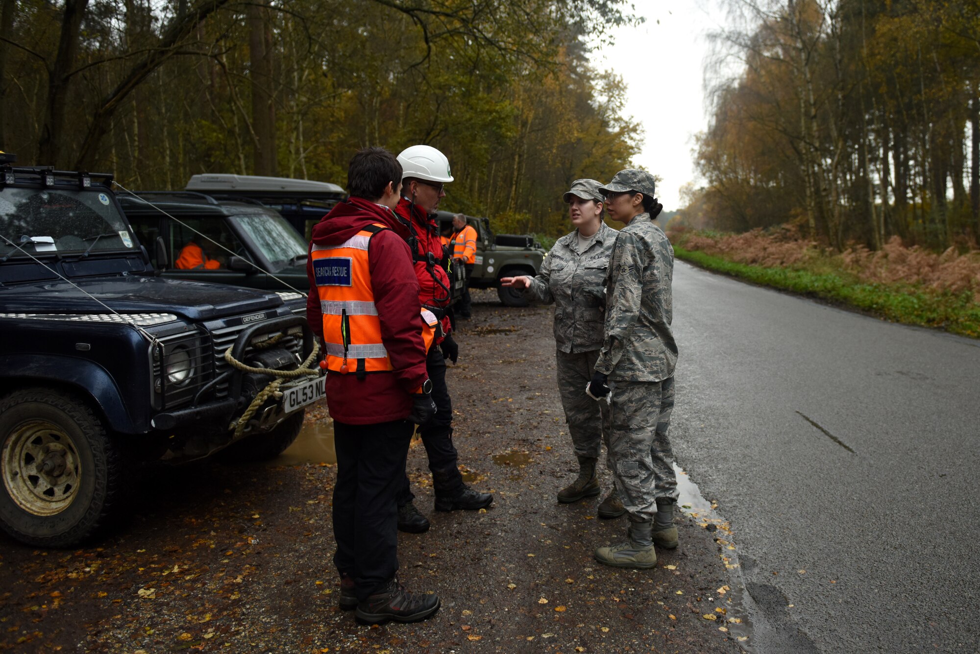 Liberty Wing Airmen briefs volunteers during a joint search and rescue event hosted by Suffolk Lowlands Search and Rescue in Thetford, England, Nov. 23, 2019. The SuLSAR event allowed U.S. Air Force medics the opportunity to build a stronger partnership working alongside emergency responders. (U.S. Air Force photo by Airman 1st Class Rhonda Smith)