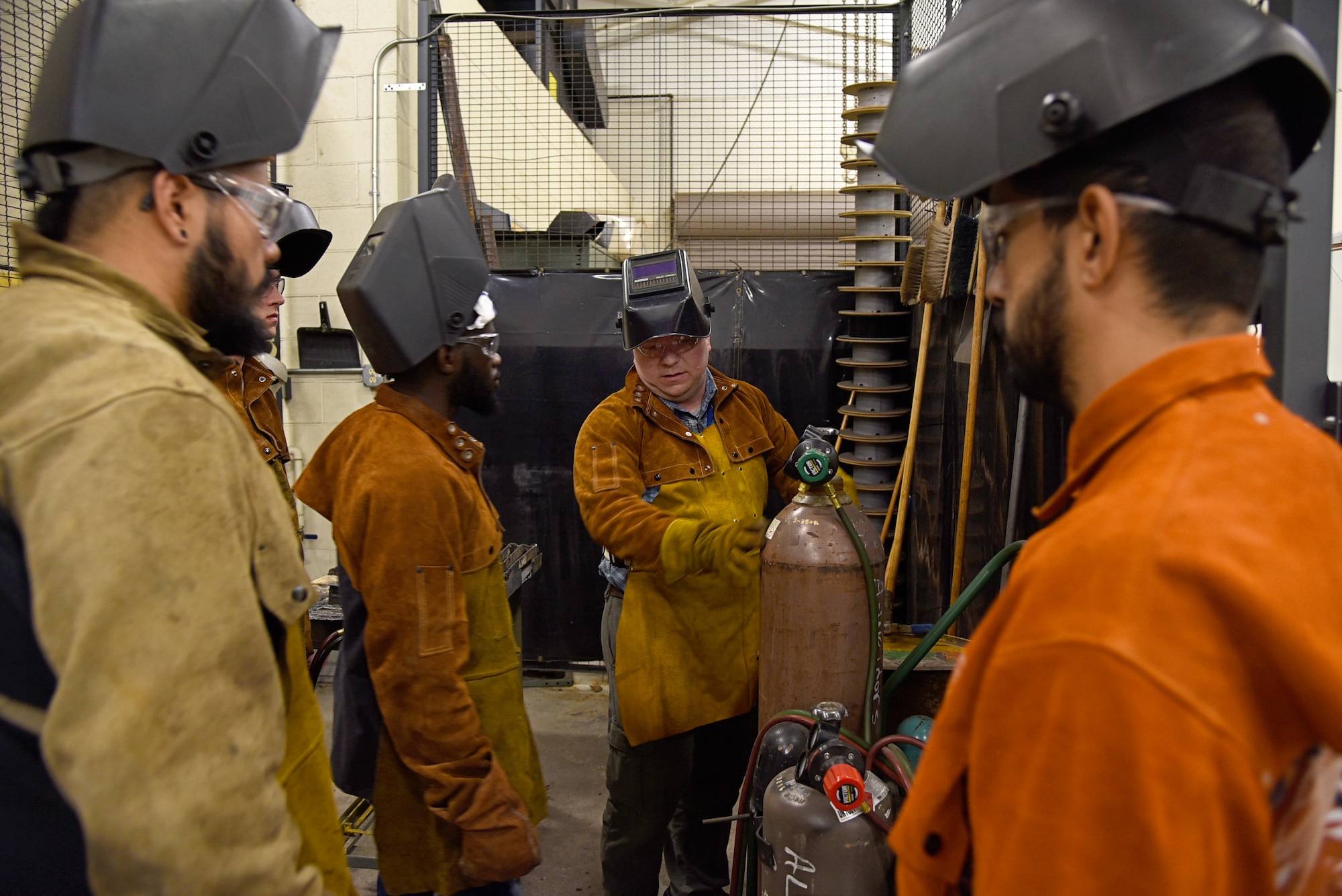 An image of Adam Dumstorf teaching an airframe welding lesson to students at MetroTech in Oklahoma City.