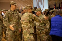 1st Theater Sustainment Command (TSC) Soldiers shake hands and say goodbye to Master Sgt. Edgar Ocegueda, maintenance management branch NCOIC, 1st TSC at a deployment ceremony Nov. 26, 2019 at Sadowski Center on Fort Knox, Ky. Ocegueda will be deploying with the Strategic Operations and Plans (SOaP) "Blue Team" to the U.S. Central Command (CENTCOM) area of operations.