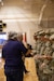 American Legion Hardin Post 113 personnel hand out coins to deploying 1st Theater Sustainment Command (TSC) Soldiers during a deployment ceremony on Nov. 26, 2019 at Sadowski Center, Fort Knox, Ky.